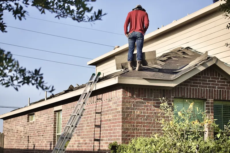 Professional roofer working on a residential roof in Modesto
